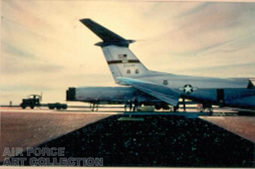 MINUTEMAN ICBM BEING LOADED ONTO A C-141B